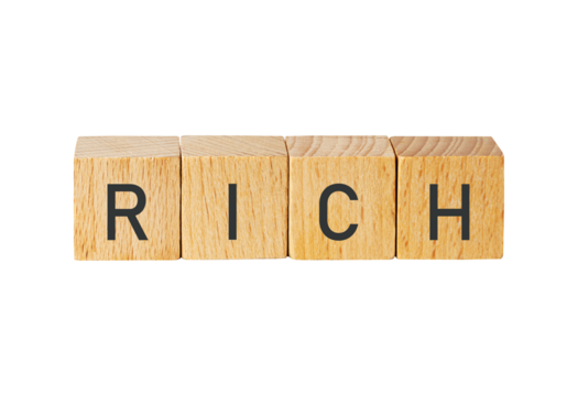 Wooden blocks spelling rich isolated on transparent background
