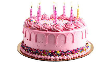 Pink frosted cake decorated with candles, sprinkles, and drips