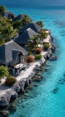 Naklejka premium Aerial View Of Tropical Water Villas With Thatched Roofs On A Rocky Shoreline Surrounded By Crystal Clear Turquoise Ocean Water On A Sunny Day