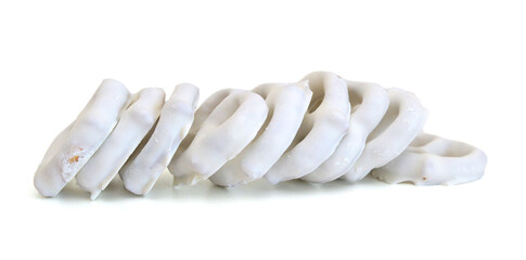 White chocolate covered pretzels on white background 