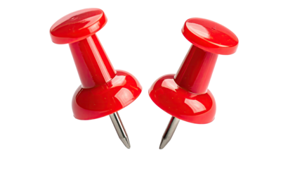 Pair of red pushpins face inward on a stark black background