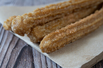 Close-up of churros with sugar and cinnamon. Mexican food