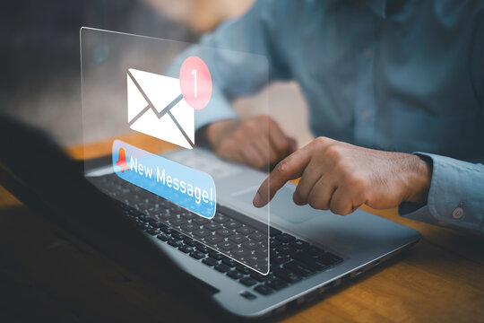 Businessman touching new message notification icon on virtual screen,email alert, online messaging system, representing digital communication, instant response, and business connectivity.