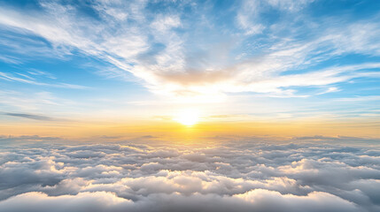Obraz premium Bright sunrise above fluffy clouds creates serene and peaceful atmosphere