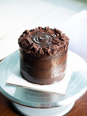 Dark chocolate cake on turntable