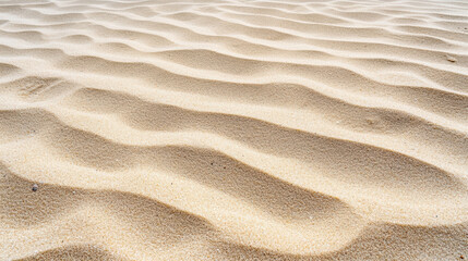 Obraz premium Gentle waves create patterns on soft sand, showcasing nature rhythm and beauty