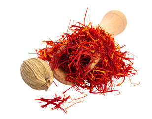 Fototapeta premium Dried Saffron Threads in Wooden Spoon with Cardamom
