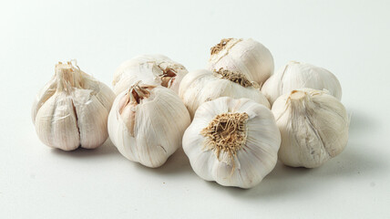 a bunch of garlic heads isolated on a white background
