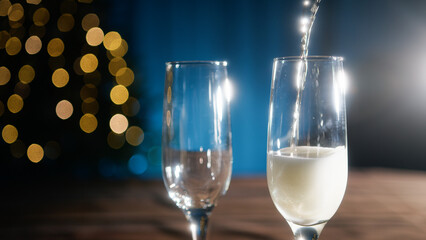valuable champagne from the bottle to the glass