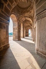 Naklejka premium 16th-century sandstone tomb of Sher Shah Suri in Sasaram, Bihar, set on a lake with a grand dome and intricate Indo-Islamic architecture reflecting history and royal elegance. 