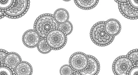 Seamless black and white pattern with intricate hand-drawn mandala circles and ornamental designs.