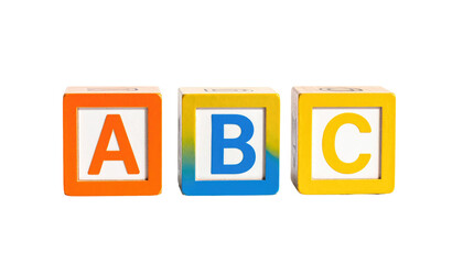 Three wooden alphabet blocks, each featuring a letter, lined up against a black background