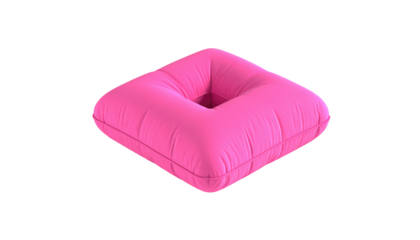 Pink square cushion with a central indentation, isolated against a black background. Soft fabric and smooth texture