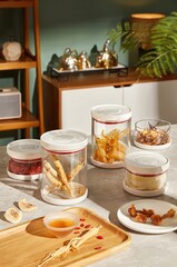 Kitchen Counter with Glass Storage Jars Containing Dried Herbs Goji Berries Ginseng and Loose Ingredients Stock Image