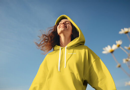 Joyful Woman In Yellow Hoodie Mockup Psd