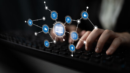 A concept image showcasing hands typing on a keyboard, surrounded by floating icons that symbolize...
