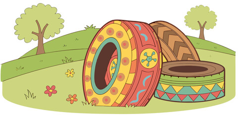 Painted old tires for playground displayed on green grass