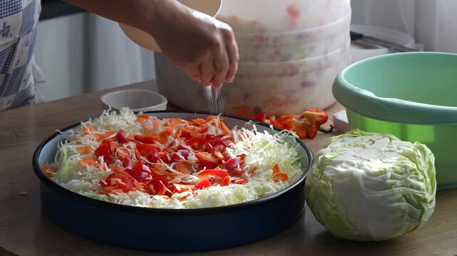 seasoning and mixing the salad