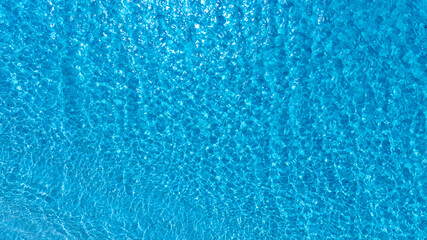 Deep sea waves. The surface of the blue sea has ripples and light reflecting on the sea.