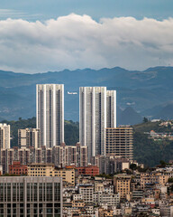 Vertical View of Guiyang Skyline with Twin Towers and Airplane
