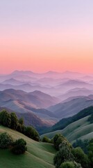 Rolling Hills Landscape at Sunset With Soft Pink Sky and Hazy Blue Mountains in the Distance