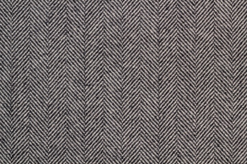 Cloth coats melange. The texture of the coat fabric close-up.