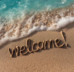 Fototapeta premium the word welcome written in the sand on an exotic beach