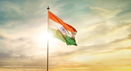 The vibrant indian national flag waves proudly in the bright sunlight against a dramatic cloudy sky