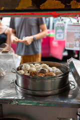 Steamed Buns in Traditional Bamboo Steamer at Bangkok Chinatown Street Food Stall