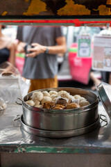 Steamed Buns in Traditional Bamboo Steamer at Bangkok Chinatown Street Food Stall