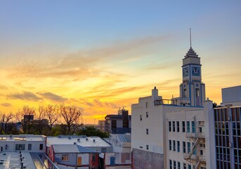 Palmerston North, Manawatu, New Zealand, October 17th, 2025.  Wonderful sunset sky behind a city clock tower.