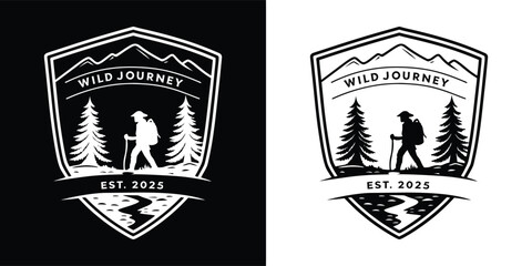 Obraz premium Black and white shieldshaped emblem logo with a hiker silhouette amidst trees and mountains, signifying a wild journey