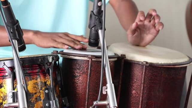 Dangdut music accompanist playing dangdut ketipung on stage

