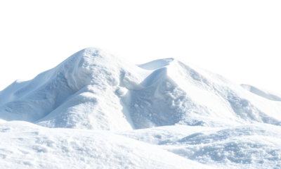 Pristine untouched winter snow dunes glisten brightly in sunlight, showcasing soft contours and pure white frozen landscape beauty and tranquility.