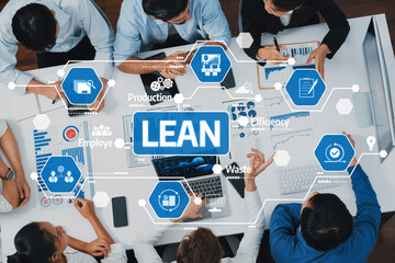 A diverse team engages in a collaborative workshop focused on Lean management techniques. They analyze processes, aiming to enhance efficiency and minimize waste. Amity