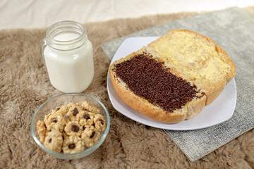 Bread with chocolate choco rice and butter with milk and snack for breakfast	

