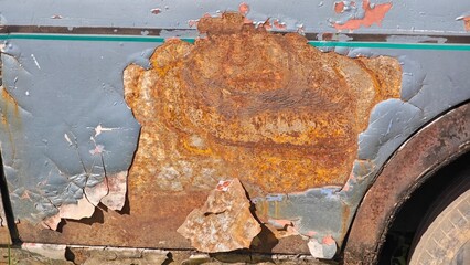 The vintage car is rusty.