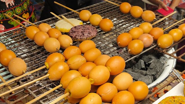 Grilled sticky rice dipped in egg  and rilled eggs