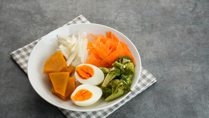 Healthy Salad Bowl, mix vegetables carrots, jicama, pumpkin, broccoli and egg