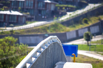 Metal or steel railing of the bridge. Handrail. No people, nobody. Horizontal photo.