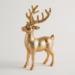 Golden decorative reindeer figure on neutral background  
