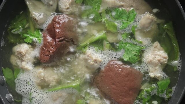 Pig blood curd with minced pork boiling in broth. Chinese food