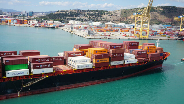 Barcelona, Spain - September 26, 2025: Cargo containers Hapag-Lloyd stored on the cargo ships.