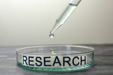 Droplet Falling on Petri Dish with Research Text in Laboratory Setting
