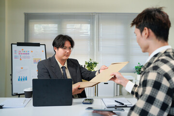 Application, hands and interview with business people in human resources office for hiring or recruitment. CV, documents or resume with manager and candidate talking in office for job opportunity