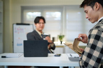 Application, hands and interview with business people in human resources office for hiring or recruitment. CV, documents or resume with manager and candidate talking in office for job opportunity