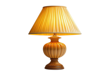 Elegant table lamp with a pleated lampshade casting a warm glow against a in a studio on transparent background