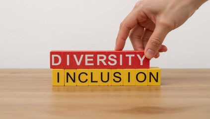 Diversity and Inclusion Concept with Wooden Blocks and Hand Arrangement