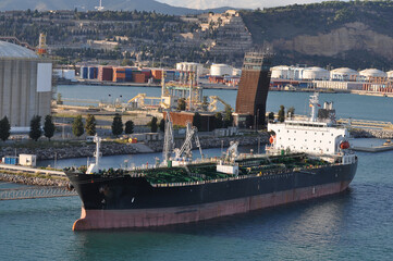 Fototapeta premium Barcelona, Spain - Cargo containers stored on the cargo ships.
