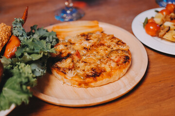 Joyful office Halloween party with coworkers in costumes, celebrating with drinks and laughter,...